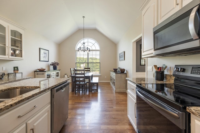 1057 The Long Run, Columbia, TN 38401 - kitchen with appliances with stainless steel finishes, a chandelier, lofted ceiling, glass insert cabinets, and wood finished floors