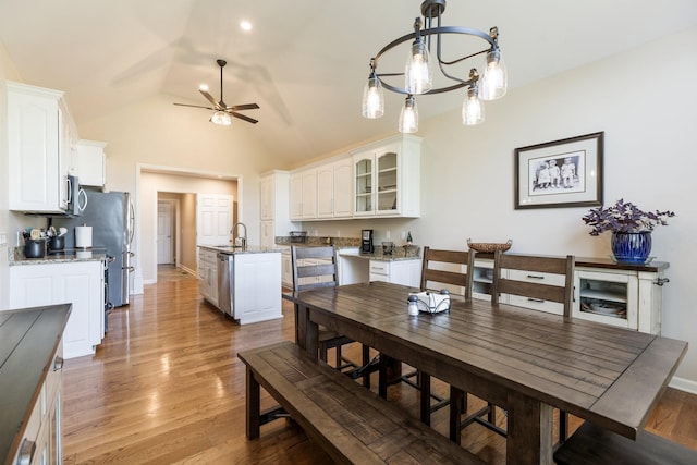 1057 The Long Run, Columbia, TN 38401 - dining area with lofted ceiling, a ceiling fan, light wood finished floors, and a chandelier