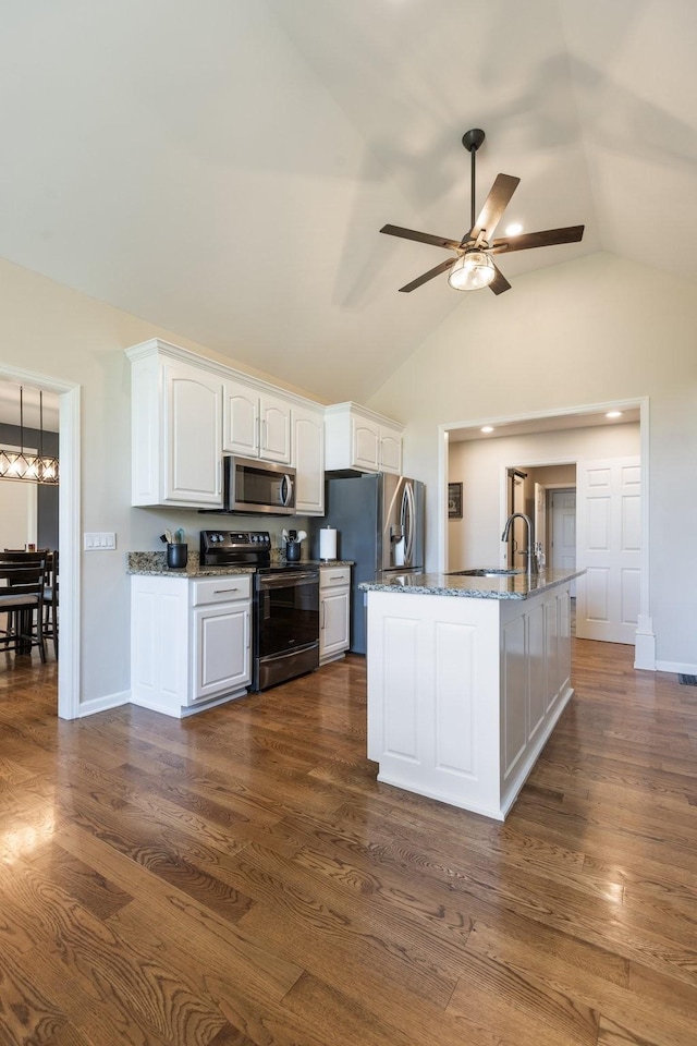 1057 The Long Run, Columbia, TN 38401 - kitchen featuring stainless steel appliances, stone counters, white cabinets, ceiling fan, and dark wood-style flooring