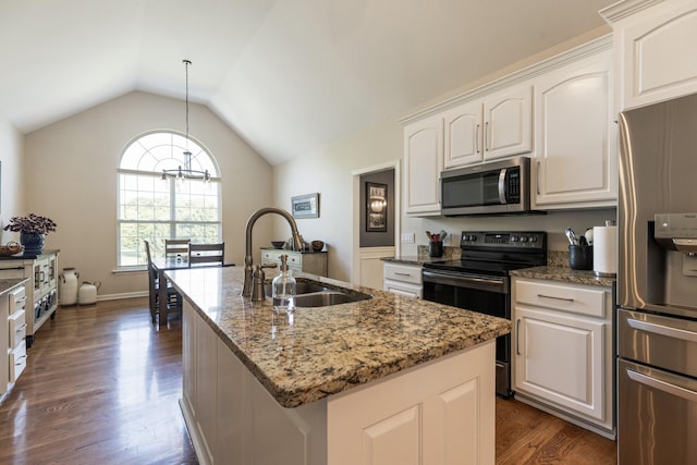 1057 The Long Run, Columbia, TN 38401 - kitchen featuring stainless steel appliances, dark wood-style flooring, lofted ceiling, light stone counters, and white cabinets