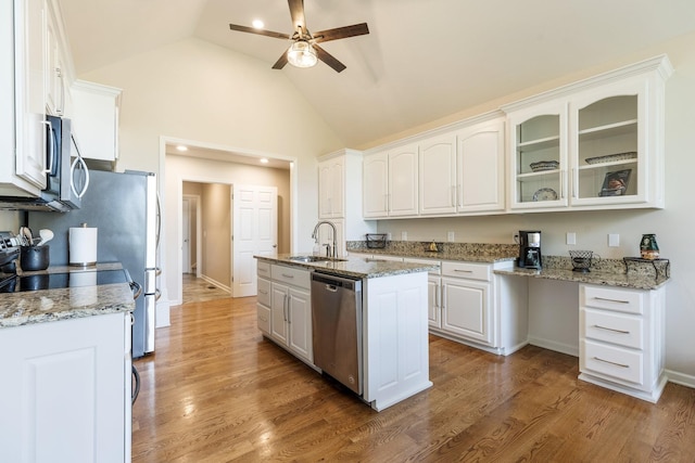 1057 The Long Run, Columbia, TN 38401 - kitchen featuring stainless steel appliances, ceiling fan, white cabinetry, glass insert cabinets, and light stone counters