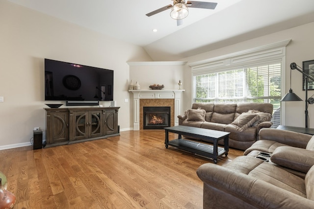 1057 The Long Run, Columbia, TN 38401 - living area featuring ceiling fan, vaulted ceiling, a fireplace, and light wood-style flooring