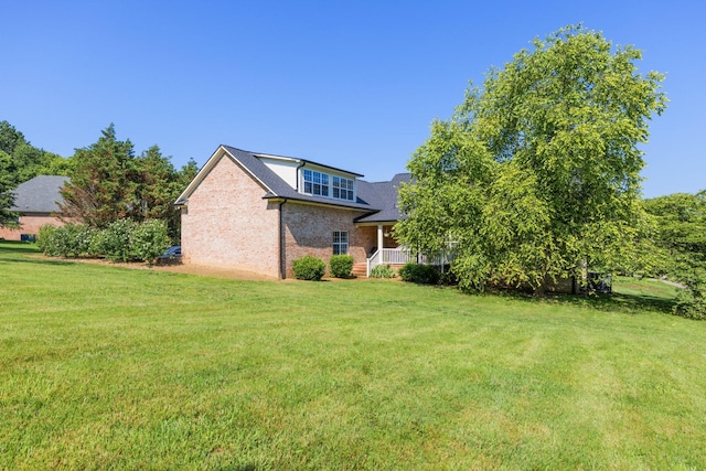 1057 The Long Run, Columbia, TN 38401 - back of house featuring a yard and brick siding
