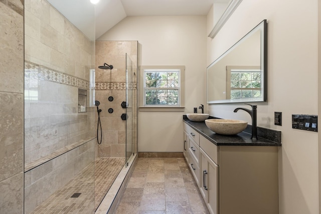 1057 The Long Run, Columbia, TN 38401 - full bath with double vanity, tiled shower, plenty of natural light, stone tile floors, and lofted ceiling