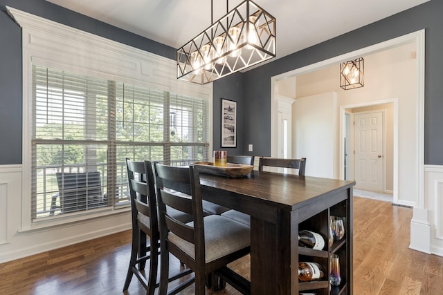 1057 The Long Run, Columbia, TN 38401 - dining room with a chandelier, wood finished floors, and wainscoting