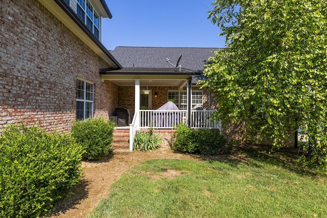 1057 The Long Run, Columbia, TN 38401 - property entrance featuring brick siding, a porch, and a lawn