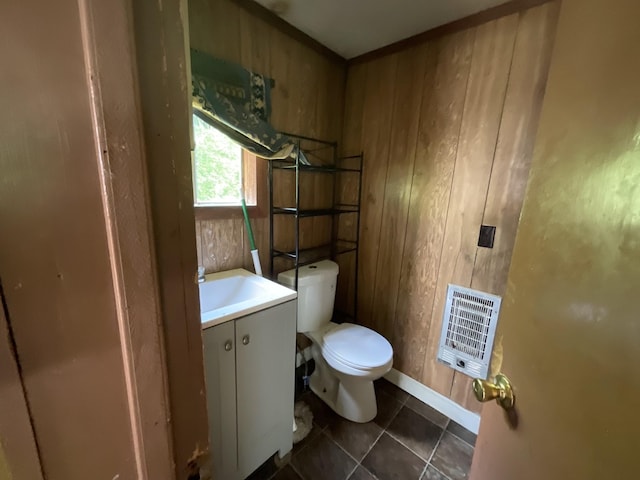 180 Barbee Ave, Ripley, TN 38063 - bathroom featuring heating unit, vanity, wood walls, and tile patterned floors
