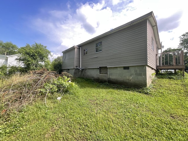 180 Barbee Ave, Ripley, TN 38063 - rear view of house featuring a deck and a yard