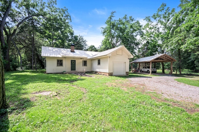 472 Shirley Rd, Smyrna, TN 37167 - view of front of home with dirt driveway, a front lawn, a chimney, a metal roof, and an attached garage