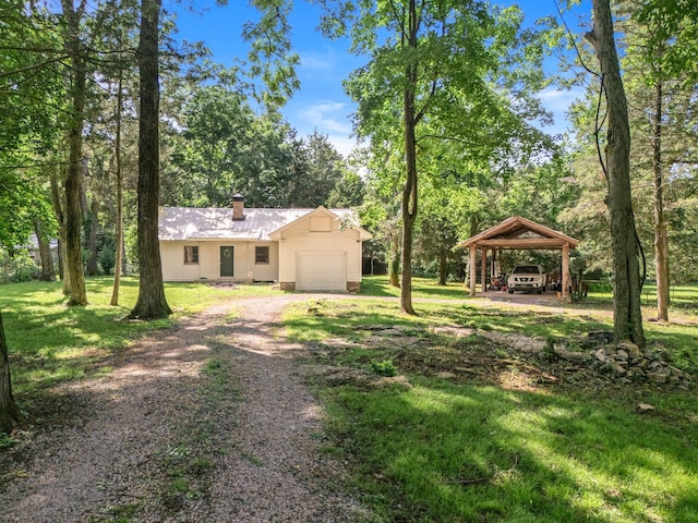 472 Shirley Rd, Smyrna, TN 37167 - view of grassy yard with dirt driveway and a garage