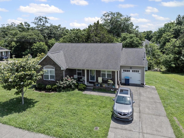 708 Rock Glen Trce, Smyrna, TN 37167 - view of front of property featuring an attached garage, driveway, a front lawn, roof with shingles, and brick siding