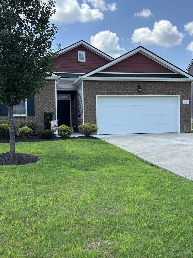601 Sheyes Cir, Columbia, TN 38401 - single story home featuring an attached garage, driveway, a front yard, and brick siding