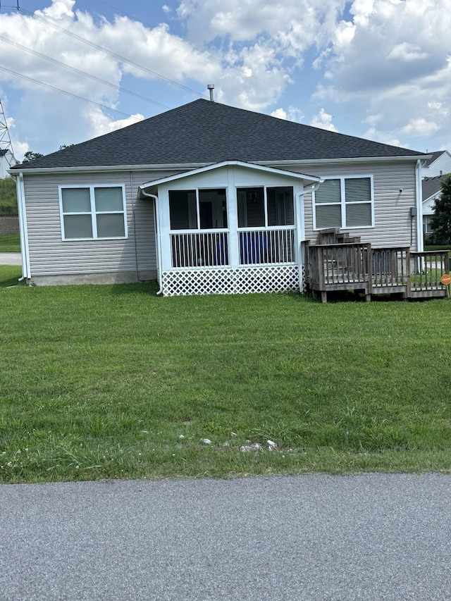 601 Sheyes Cir, Columbia, TN 38401 - view of front of property featuring a sunroom, a front yard, a deck, and roof with shingles
