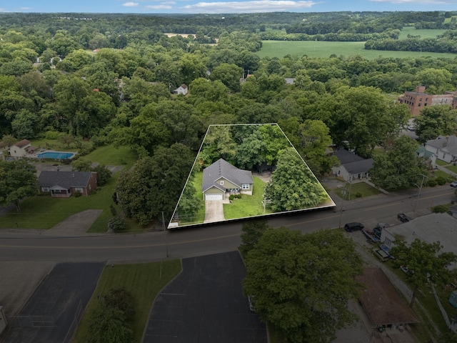 103 N Main St, Springfield, TN 37172 - aerial overview of property's location with property parcel outlined and a forest