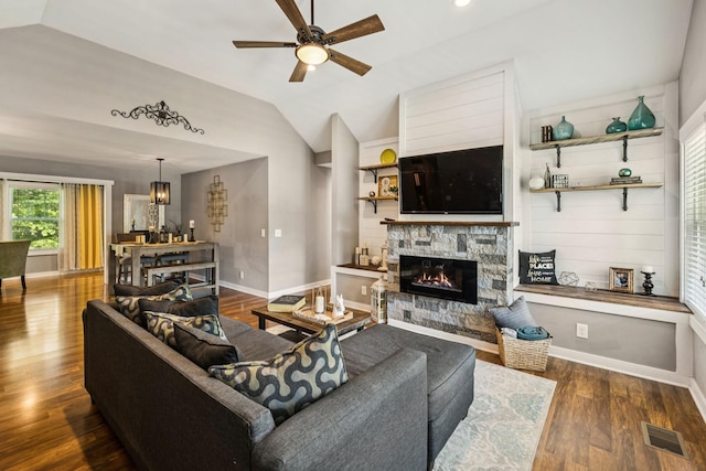 103 N Main St, Springfield, TN 37172 - living room featuring vaulted ceiling, ceiling fan, a fireplace, wood finished floors, and a chandelier