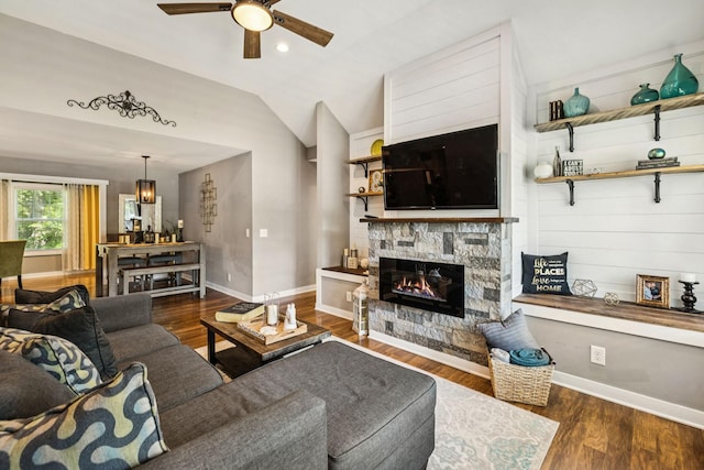 103 N Main St, Springfield, TN 37172 - living area with lofted ceiling, a ceiling fan, wood finished floors, a stone fireplace, and a chandelier