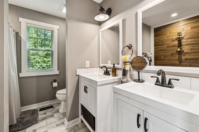 103 N Main St, Springfield, TN 37172 - bathroom with two vanities, marble finish flooring, and recessed lighting