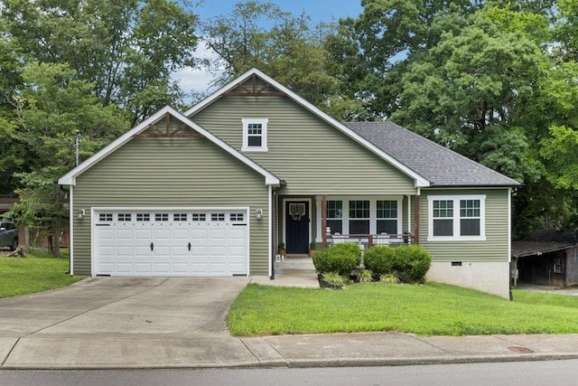 103 N Main St, Springfield, TN 37172 - traditional home with covered porch, driveway, a front yard, an attached garage, and roof with shingles