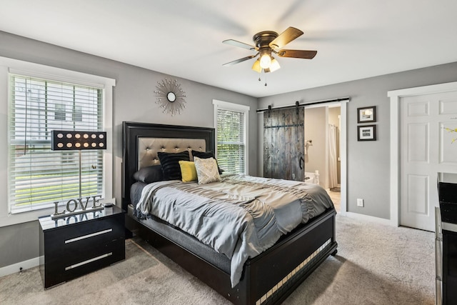 103 N Main St, Springfield, TN 37172 - bedroom featuring carpet floors, a barn door, ceiling fan, and connected bathroom