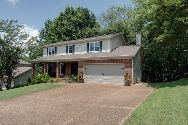 1448 Brighton Cir, Old Hickory, TN 37138 - view of front of home featuring driveway, brick siding, a front lawn, a chimney, and a porch