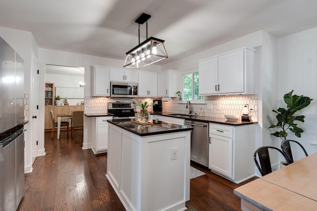 1448 Brighton Cir, Old Hickory, TN 37138 - kitchen with appliances with stainless steel finishes, backsplash, dark wood-style floors, and white cabinetry