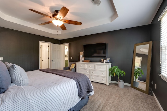 1448 Brighton Cir, Old Hickory, TN 37138 - bedroom featuring a tray ceiling, light colored carpet, ceiling fan, and multiple windows