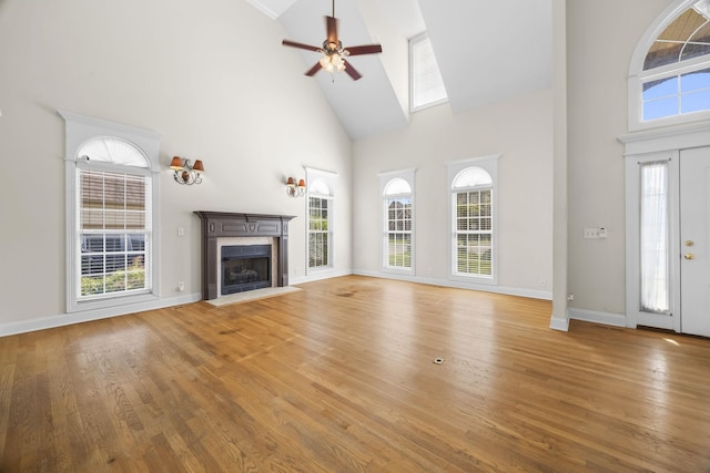 2357 Saint Andrews Dr, Murfreesboro, TN 37128 - unfurnished living room featuring high vaulted ceiling, a ceiling fan, a high end fireplace, healthy amount of natural light, and light wood-style floors