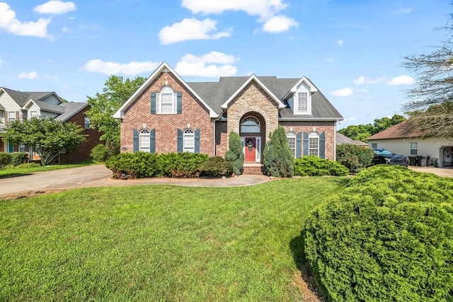 2357 Saint Andrews Dr, Murfreesboro, TN 37128 - traditional home with brick siding, a front lawn, and a shingled roof
