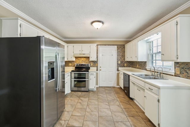 3171 Asbury Ln, Murfreesboro, TN 37129 - kitchen with stainless steel appliances, under cabinet range hood, crown molding, decorative backsplash, and a textured ceiling