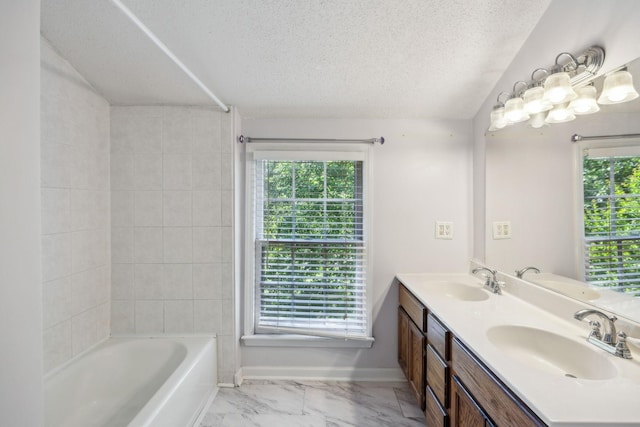 3171 Asbury Ln, Murfreesboro, TN 37129 - bathroom with a textured ceiling, healthy amount of natural light, double vanity, marble look tiles, and shower / bathtub combination