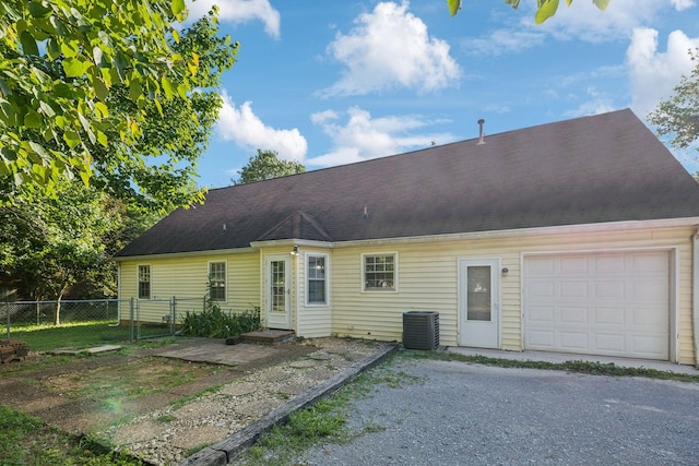3171 Asbury Ln, Murfreesboro, TN 37129 - back of property featuring an attached garage and gravel driveway