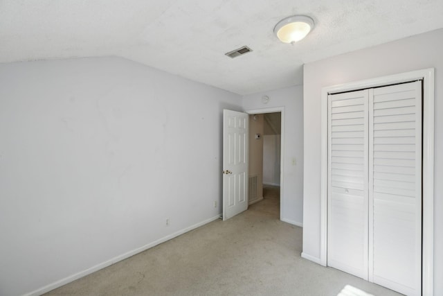 3171 Asbury Ln, Murfreesboro, TN 37129 - unfurnished bedroom featuring light carpet, a closet, and vaulted ceiling