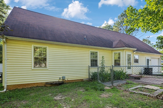 3171 Asbury Ln, Murfreesboro, TN 37129 - rear view of house with a shingled roof and a garage
