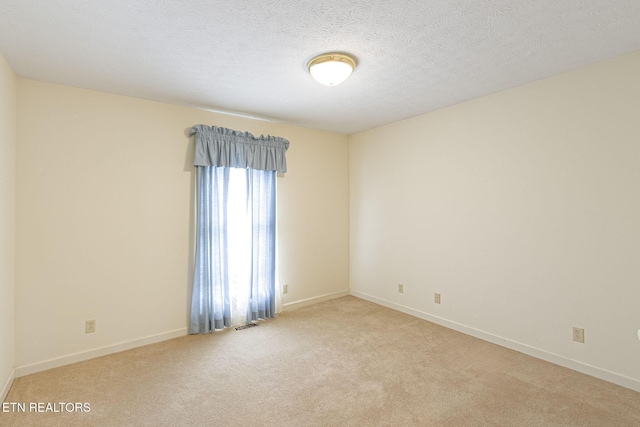 182 Whippoorwill Dr, Oak Ridge, TN 37830 - carpeted empty room with baseboards and a textured ceiling