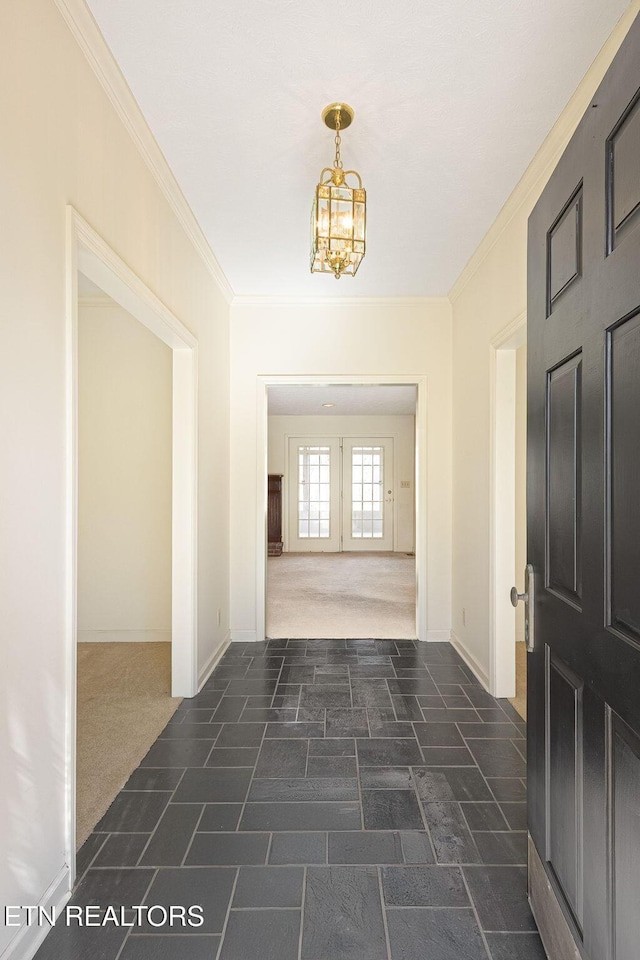 182 Whippoorwill Dr, Oak Ridge, TN 37830 - foyer with crown molding, a chandelier, dark carpet, and french doors