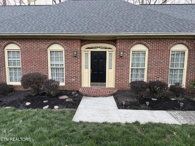 182 Whippoorwill Dr, Oak Ridge, TN 37830 - property entrance with roof with shingles and brick siding