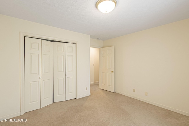 182 Whippoorwill Dr, Oak Ridge, TN 37830 - unfurnished bedroom featuring light carpet and a closet