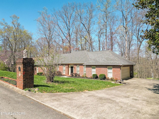 182 Whippoorwill Dr, Oak Ridge, TN 37830 - view of front of house featuring an attached garage, driveway, a front lawn, brick siding, and a shingled roof