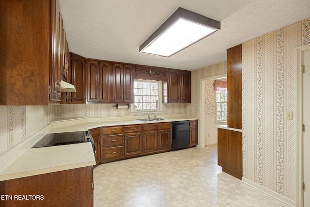 182 Whippoorwill Dr, Oak Ridge, TN 37830 - kitchen with dishwasher, wallpapered walls, under cabinet range hood, light countertops, and light floors