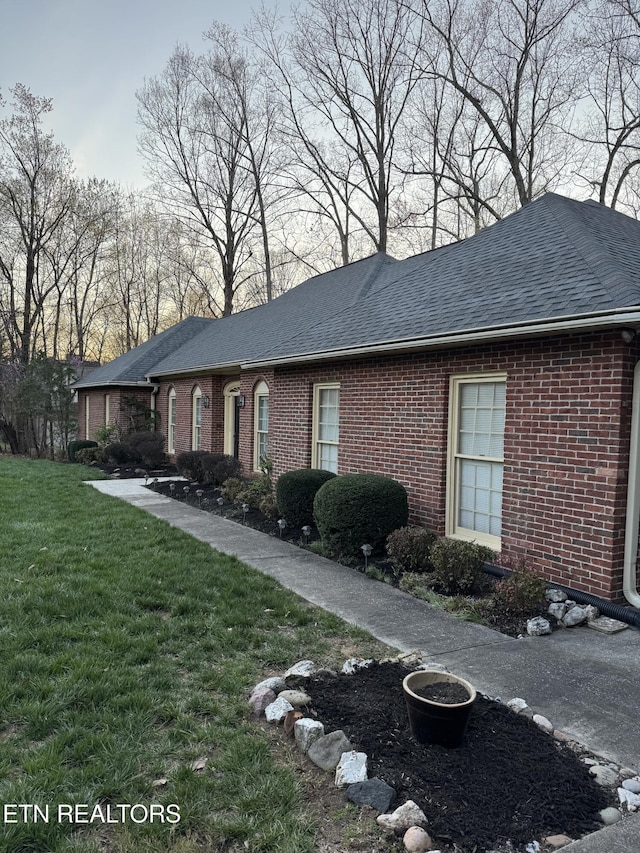 182 Whippoorwill Dr, Oak Ridge, TN 37830 - view of front of property featuring brick siding, a front lawn, and a shingled roof