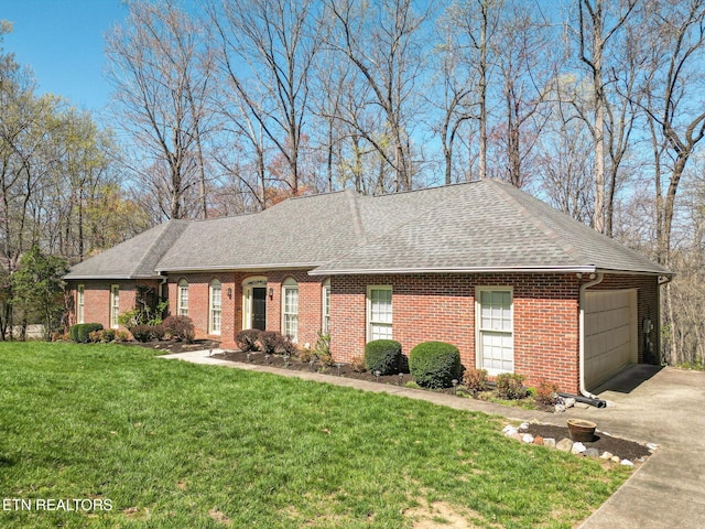 182 Whippoorwill Dr, Oak Ridge, TN 37830 - view of front of house with concrete driveway, a front lawn, a shingled roof, and brick siding