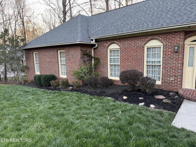 182 Whippoorwill Dr, Oak Ridge, TN 37830 - view of side of property featuring a shingled roof, brick siding, and a lawn