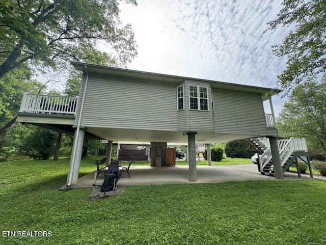 2032 Slippery Rock Cir, Sevierville, TN 37862 - view of side of property with a carport, stairs, a yard, and a patio area