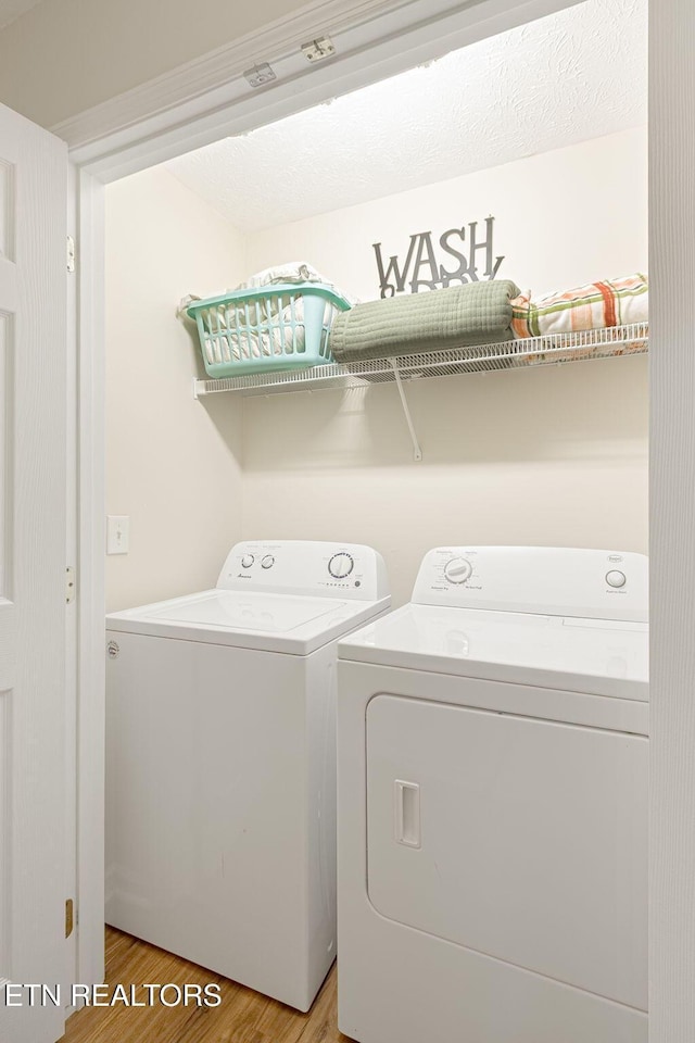 2032 Slippery Rock Cir, Sevierville, TN 37862 - laundry area featuring washing machine and dryer and light wood-style flooring