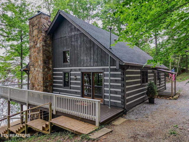 1226 Buzzard Roost Rd, Spring City, TN 37381 - back of property featuring roof with shingles, a deck, and a chimney