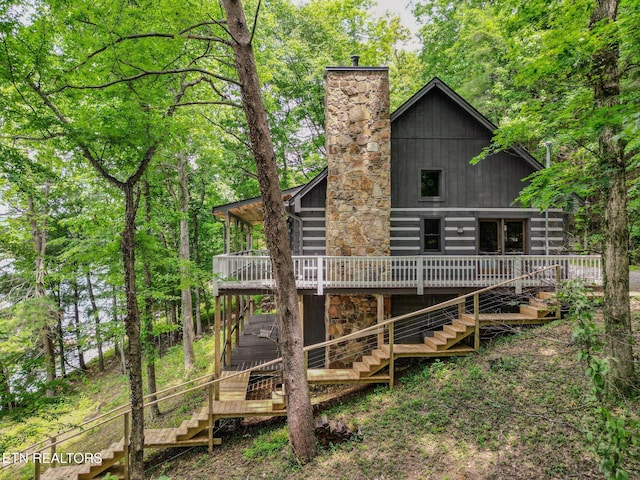 1226 Buzzard Roost Rd, Spring City, TN 37381 - rear view of property featuring stairs, a deck, a chimney, and stone siding