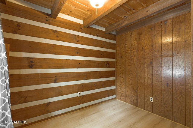 1226 Buzzard Roost Rd, Spring City, TN 37381 - empty room with wood walls, light wood-style flooring, and a wood ceiling with exposed beams
