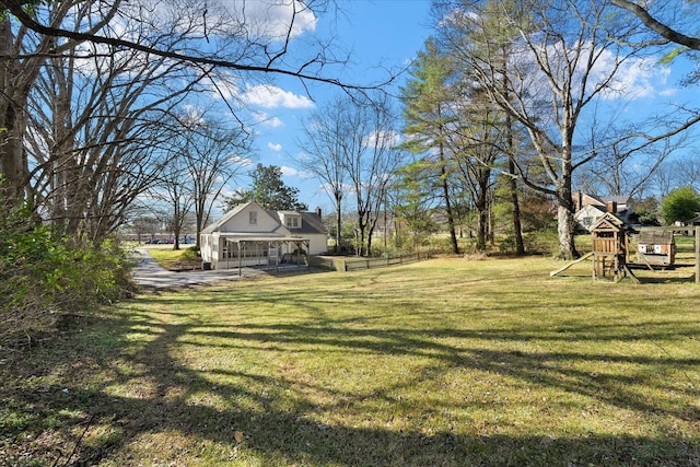 1302 Hampshire Pike, Columbia, TN 38401 - view of green lawn featuring a playground and a porch