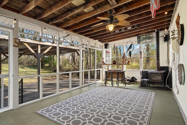 1302 Hampshire Pike, Columbia, TN 38401 - sunroom / solarium with a ceiling fan, a wood stove, and beam ceiling