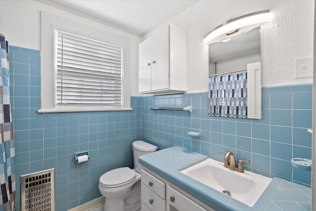 1302 Hampshire Pike, Columbia, TN 38401 - full bathroom with tile walls, vanity, a shower with curtain, a wainscoted wall, and heating unit
